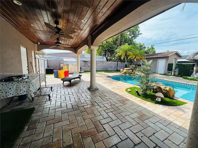 180 E 46th St, Hialeah, FL 33013 - fenced backyard with a patio, ceiling fan, and a shed