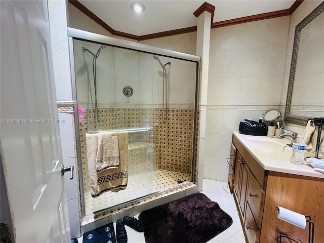 180 E 46th St, Hialeah, FL 33013 - bathroom with vanity, tile walls, a stall shower, crown molding, and tile patterned flooring
