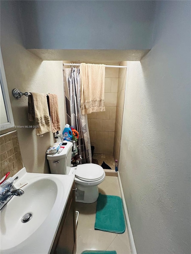 180 E 46th St, Hialeah, FL 33013 - bathroom featuring a stall shower, vanity, a textured wall, and tile patterned flooring