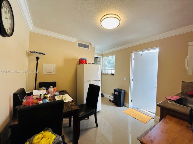 180 E 46th St, Hialeah, FL 33013 - dining room with crown molding, an office area, a textured ceiling, and light tile patterned floors