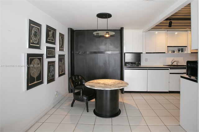 1800 NE 114th St Unit Ph06, Miami, FL 33181 - kitchen with dark countertops, white cabinets, hanging light fixtures, open shelves, and white dishwasher