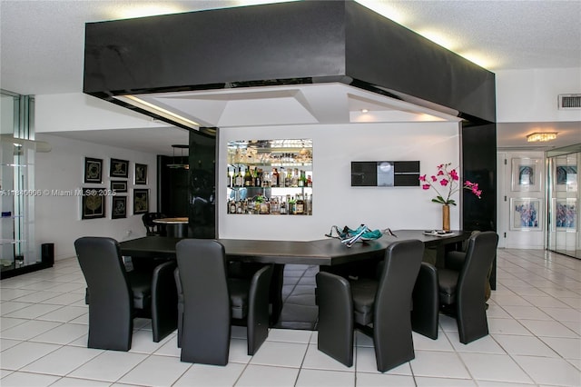 1800 NE 114th St Unit Ph06, Miami, FL 33181 - indoor wet bar featuring light tile patterned floors, a textured ceiling, and ventilation hood