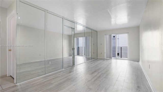 1033 Lenox Ave Unit 304, Miami Beach, FL 33139 - unfurnished room with light wood-style flooring