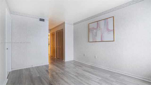 1033 Lenox Ave Unit 304, Miami Beach, FL 33139 - spare room featuring wood finished floors