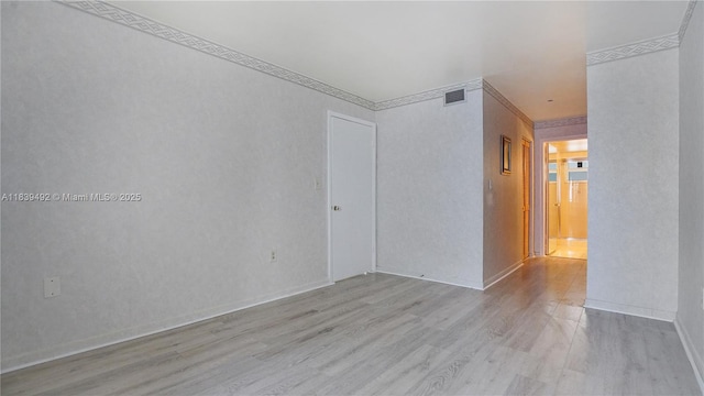 1033 Lenox Ave Unit 304, Miami Beach, FL 33139 - empty room with wood finished floors and ornamental molding