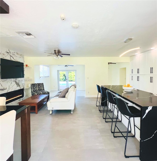 9130 SW 17th Ter, Miami, FL 33165 - living area featuring a ceiling fan and baseboards