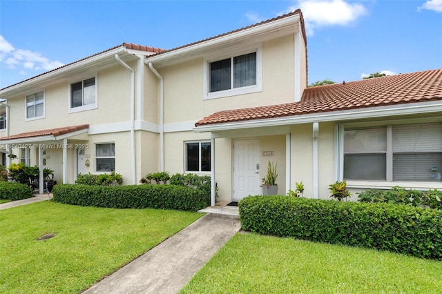 6348 Walk Cir, Boca Raton, FL 33433 - mediterranean / spanish-style house featuring a tiled roof, a front yard, and stucco siding
