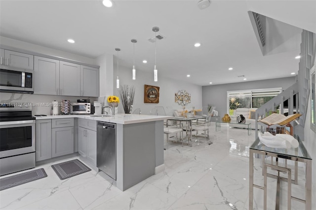6348 Walk Cir, Boca Raton, FL 33433 - kitchen with appliances with stainless steel finishes, gray cabinetry, light marble finish floors, recessed lighting, and light countertops