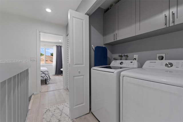 6348 Walk Cir, Boca Raton, FL 33433 - laundry area featuring washing machine and clothes dryer, cabinet space, light wood finished floors, and recessed lighting