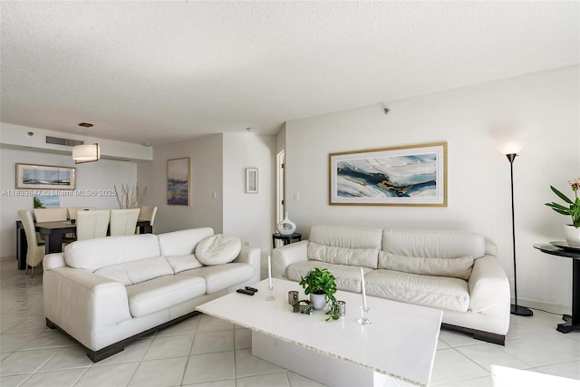 3530 Mystic Pointe Dr Unit 2014, Aventura, FL 33180 - living area featuring a textured ceiling and light tile patterned floors