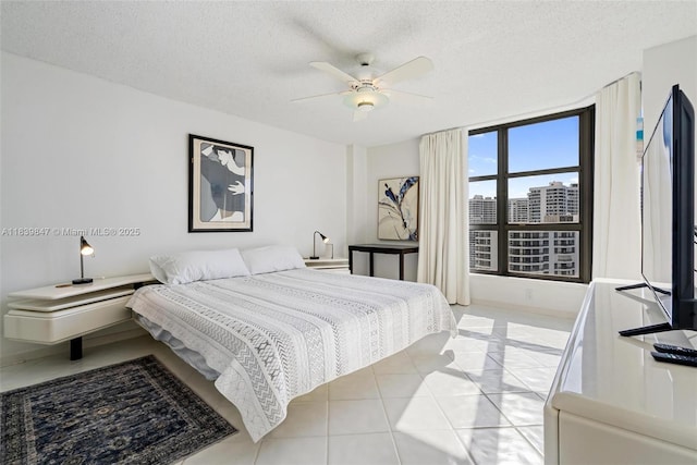 3530 Mystic Pointe Dr Unit 2014, Aventura, FL 33180 - bedroom with a textured ceiling, light tile patterned floors, and ceiling fan
