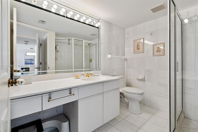 3530 Mystic Pointe Dr Unit 2014, Aventura, FL 33180 - bathroom featuring tile walls, a shower stall, and vanity