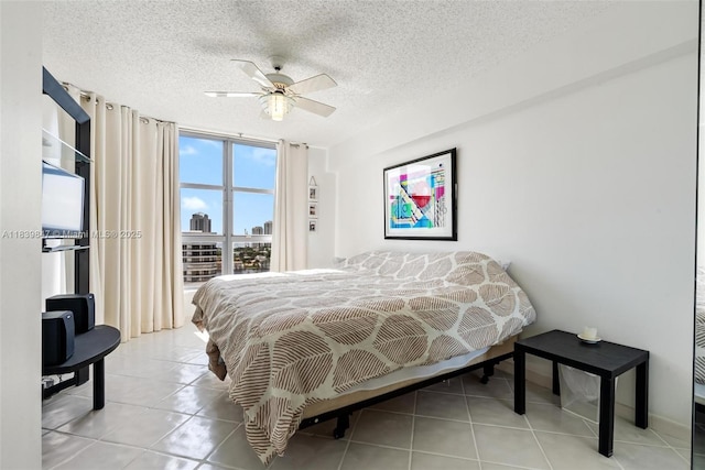 3530 Mystic Pointe Dr Unit 2014, Aventura, FL 33180 - tiled bedroom with ceiling fan and a textured ceiling