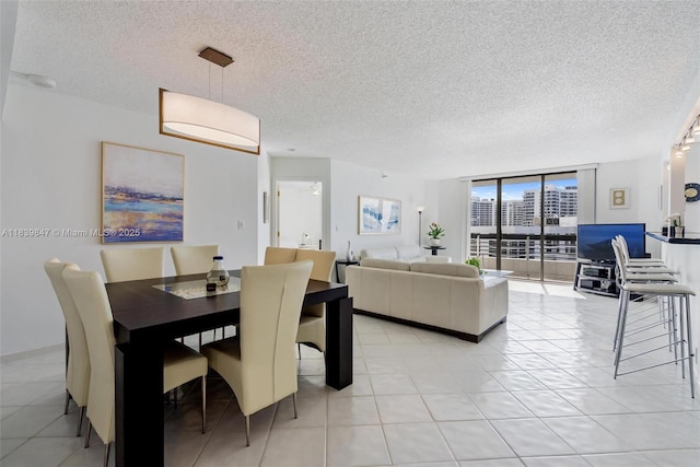 3530 Mystic Pointe Dr Unit 2014, Aventura, FL 33180 - dining space with a textured ceiling and floor to ceiling windows