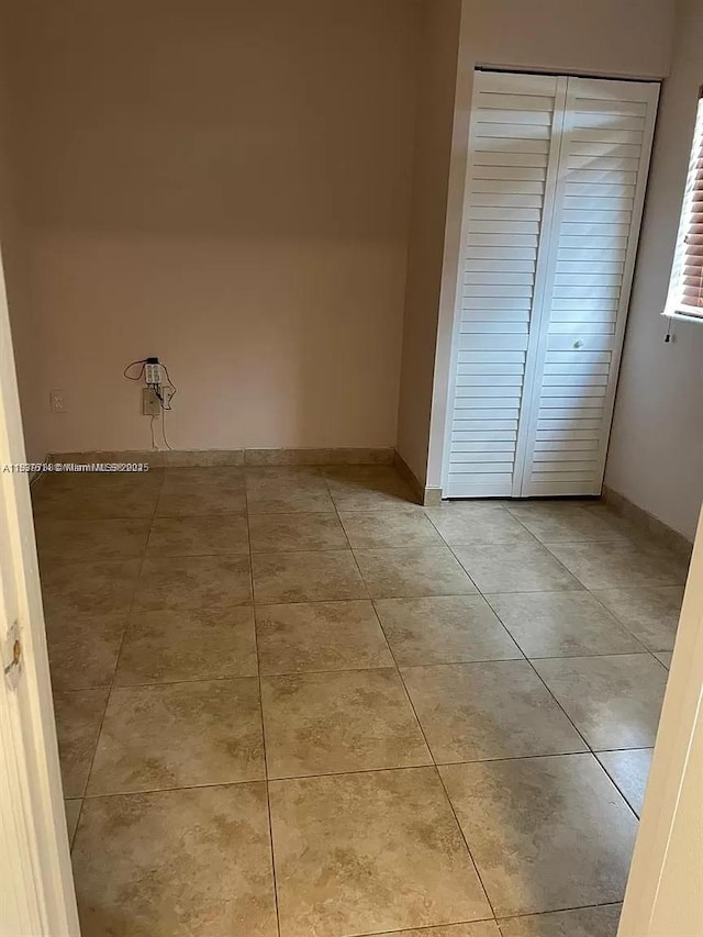 3690 N 56th Ave Unit 916, Hollywood, FL 33021 - unfurnished room with light tile patterned floors and baseboards