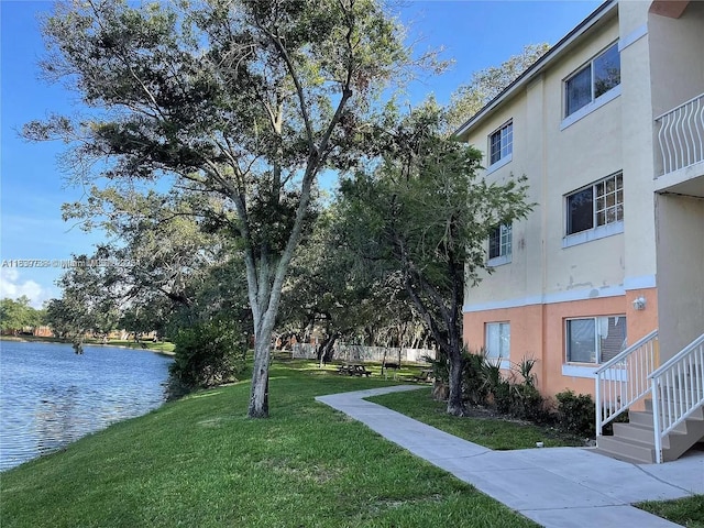 3690 N 56th Ave Unit 916, Hollywood, FL 33021 - surrounding community featuring a lawn and a water view