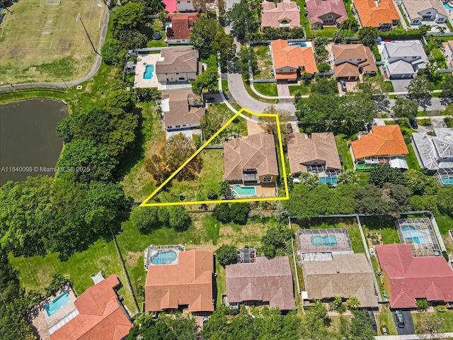 13063 NW 11th Ct, Sunrise, FL 33323 - aerial view of residential area featuring property boundaries highlighted and a nearby body of water