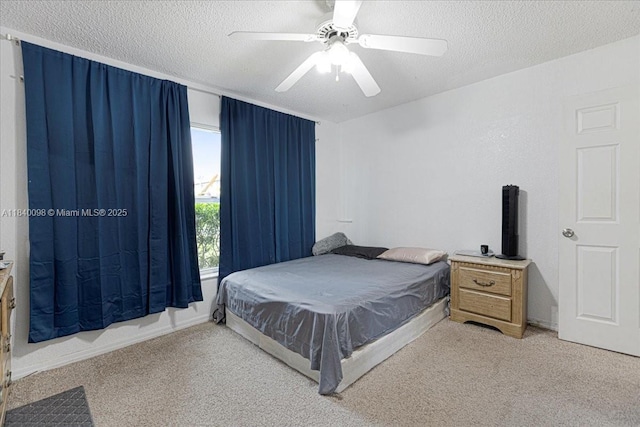 13063 NW 11th Ct, Sunrise, FL 33323 - bedroom featuring light colored carpet, a textured ceiling, and a ceiling fan