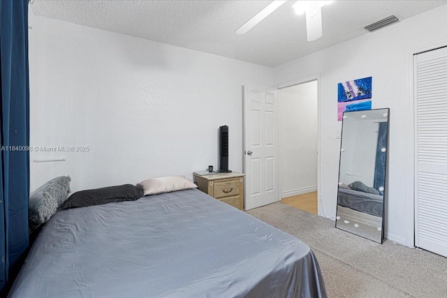 13063 NW 11th Ct, Sunrise, FL 33323 - bedroom with light carpet, a closet, a ceiling fan, and a textured ceiling