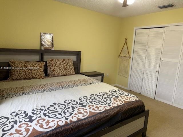 13063 NW 11th Ct, Sunrise, FL 33323 - bedroom featuring a closet, carpet flooring, a ceiling fan, and a textured ceiling