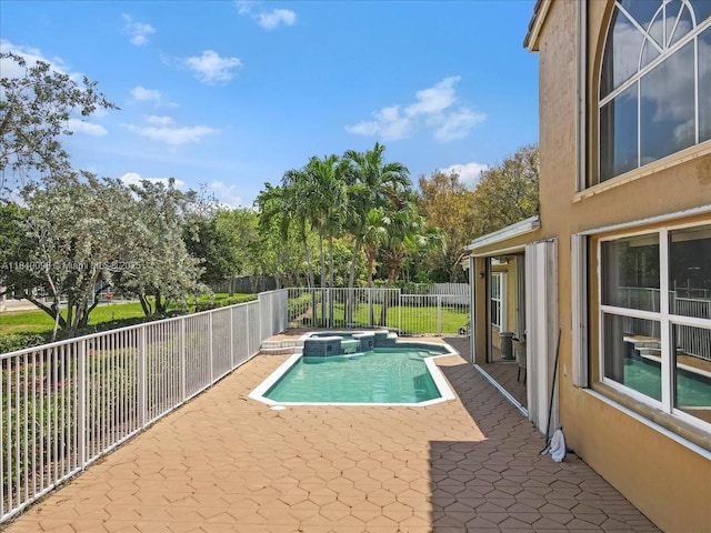 13063 NW 11th Ct, Sunrise, FL 33323 - view of pool with a pool with connected hot tub, a patio, a fenced backyard, and view of scattered trees
