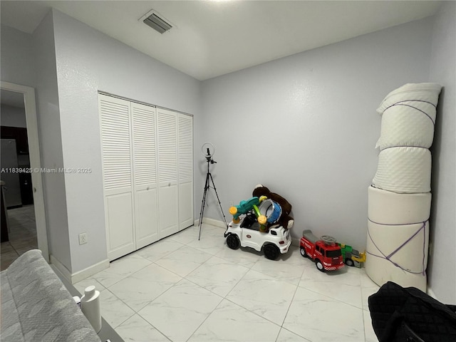 730 SE 34th Ave, Homestead, FL 33033 - game room with light marble finish floors and baseboards