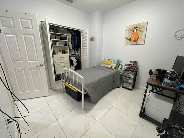 730 SE 34th Ave, Homestead, FL 33033 - bedroom with light marble finish floors and a closet