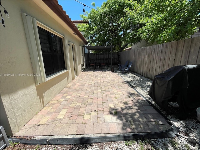 730 SE 34th Ave, Homestead, FL 33033 - fenced backyard featuring a patio and grilling area