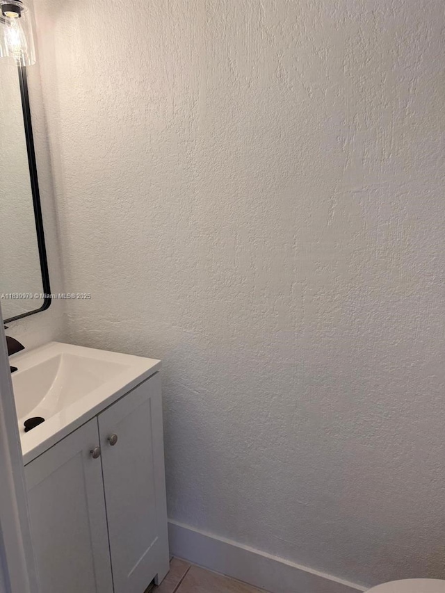 3860 W 11th Ln, Hialeah, FL 33012 - bathroom with vanity and tile patterned flooring