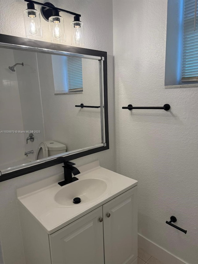 3860 W 11th Ln, Hialeah, FL 33012 - bathroom with vanity, shower / tub combination, a textured wall, and tile patterned flooring