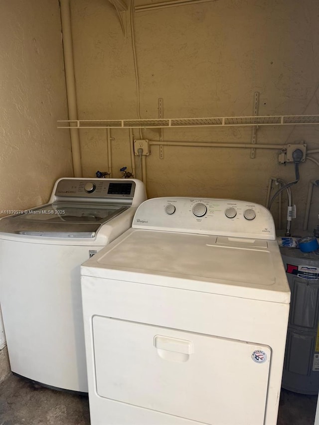 3860 W 11th Ln, Hialeah, FL 33012 - laundry room featuring washing machine and dryer and water heater