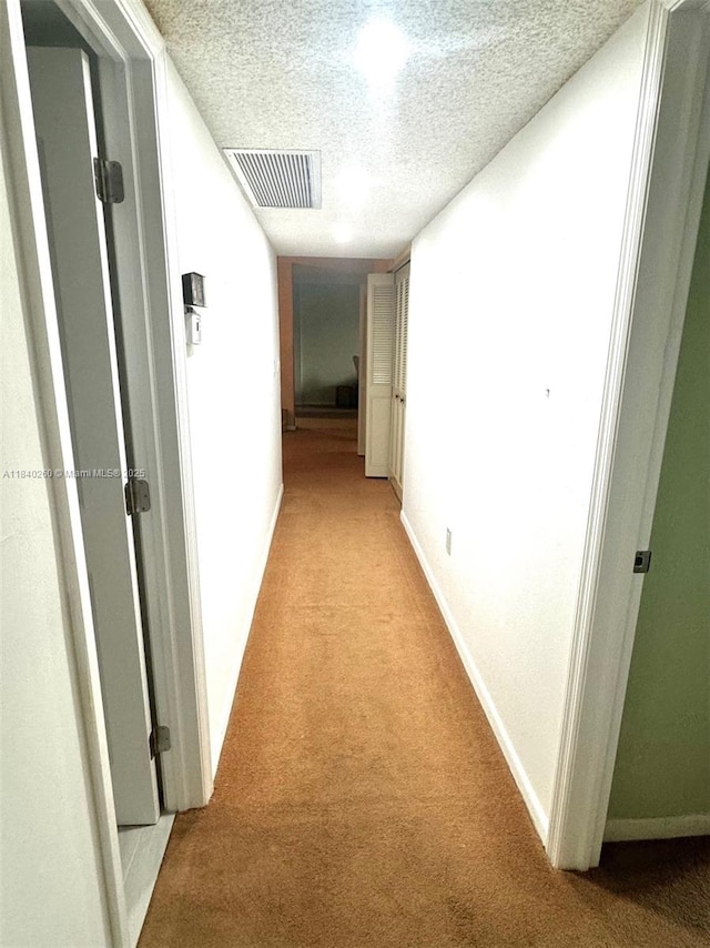 6911 SW 147th Ave Unit 3C, Miami, FL 33193 - hall with light carpet and a textured ceiling