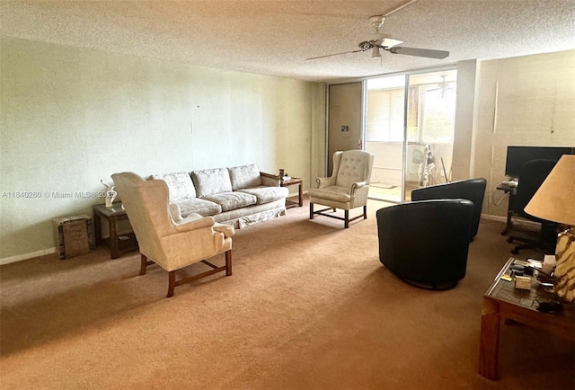 6911 SW 147th Ave Unit 3C, Miami, FL 33193 - carpeted living room featuring a textured ceiling and a ceiling fan
