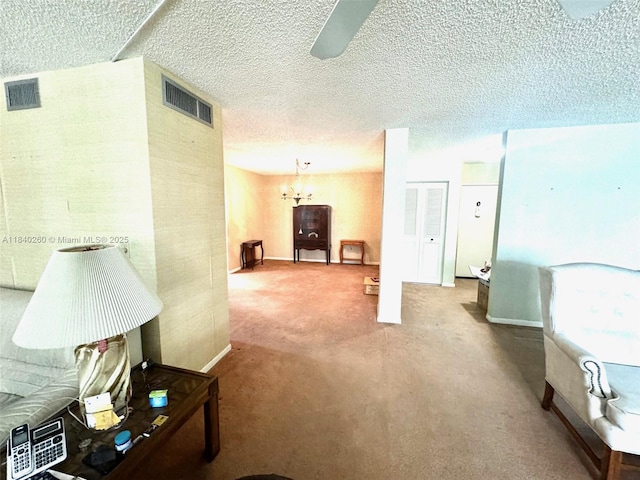 6911 SW 147th Ave Unit 3C, Miami, FL 33193 - hall with carpet, a chandelier, and a textured ceiling