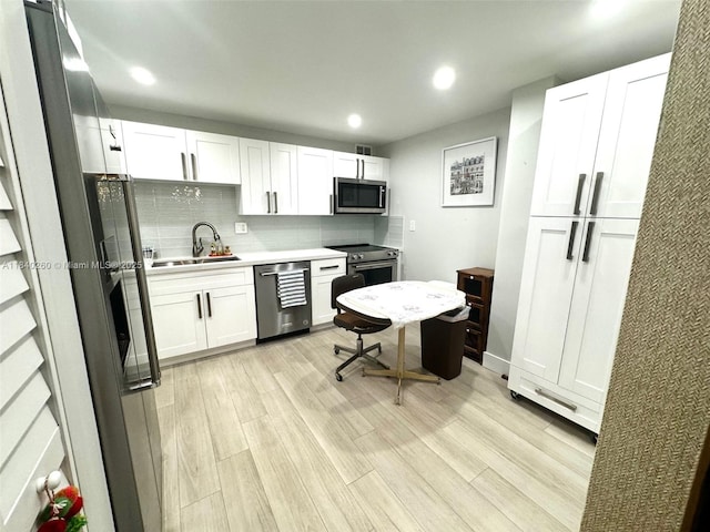 6911 SW 147th Ave Unit 3C, Miami, FL 33193 - kitchen with appliances with stainless steel finishes, tasteful backsplash, recessed lighting, light countertops, and white cabinetry