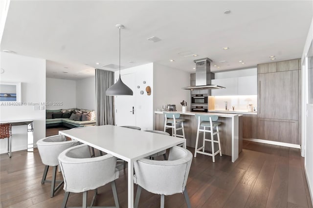 360 Ocean Dr Unit 704S, Key Biscayne, FL 33149 - dining room with dark wood finished floors and recessed lighting