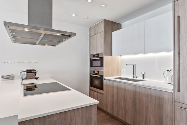 360 Ocean Dr Unit 704S, Key Biscayne, FL 33149 - kitchen featuring island exhaust hood, modern cabinets, light countertops, and black electric cooktop