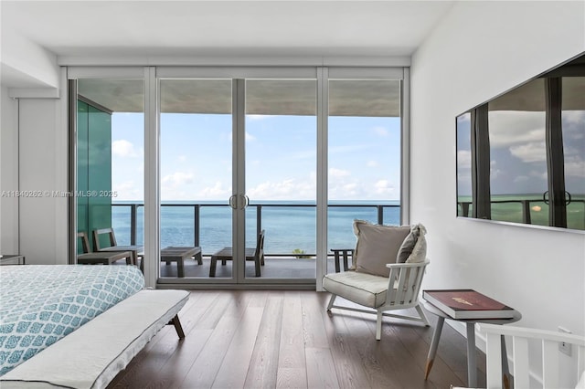 360 Ocean Dr Unit 704S, Key Biscayne, FL 33149 - bedroom with a wall of windows, a water view, multiple windows, and wood finished floors