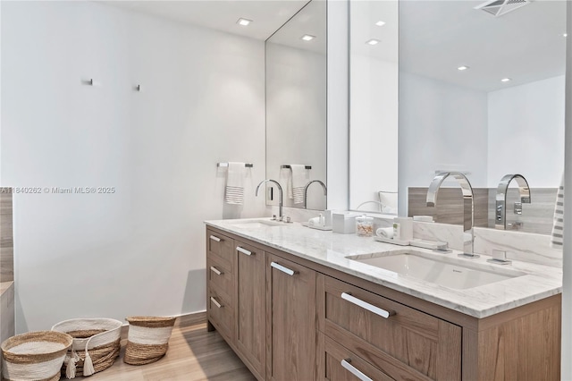 360 Ocean Dr Unit 704S, Key Biscayne, FL 33149 - full bathroom featuring double vanity, wood finished floors, and recessed lighting
