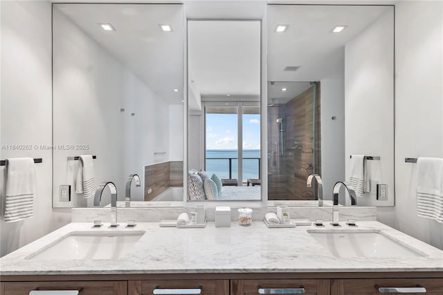 360 Ocean Dr Unit 704S, Key Biscayne, FL 33149 - full bathroom featuring double vanity, a water view, and a shower stall
