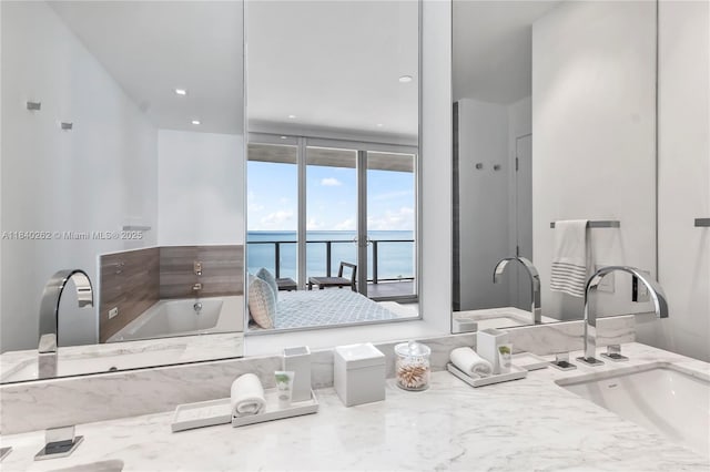 360 Ocean Dr Unit 704S, Key Biscayne, FL 33149 - full bath with a water view, a bath, vanity, and floor to ceiling windows