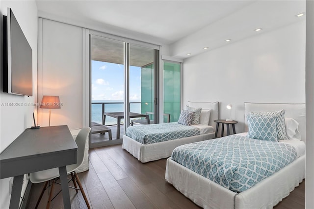 360 Ocean Dr Unit 704S, Key Biscayne, FL 33149 - bedroom with expansive windows, access to outside, hardwood / wood-style floors, a water view, and recessed lighting