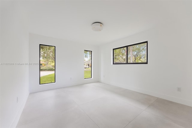 7805 SW 165th St, Palmetto Bay, FL 33157 - spare room with concrete floors and baseboards