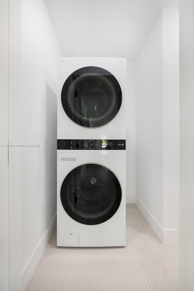 7805 SW 165th St, Palmetto Bay, FL 33157 - washroom with stacked washer / drying machine and baseboards