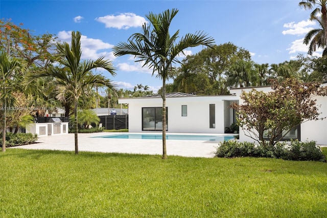 7805 SW 165th St, Palmetto Bay, FL 33157 - rear view of house featuring stucco siding and an outdoor pool