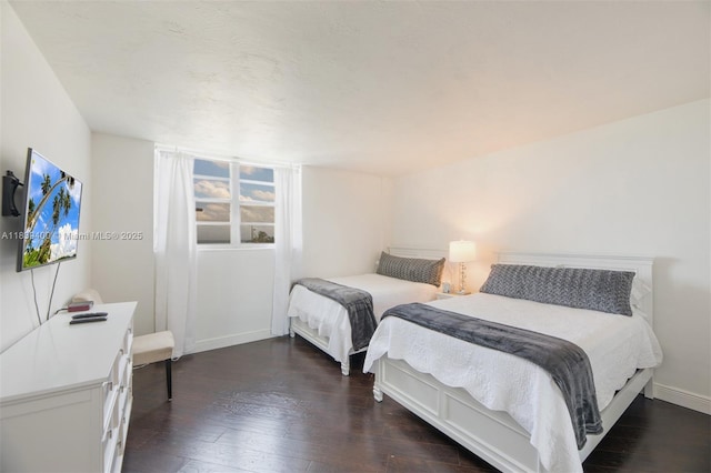 3801 S Ocean Dr Unit 5L, Hollywood, FL 33019 - bedroom with dark wood-type flooring and baseboards