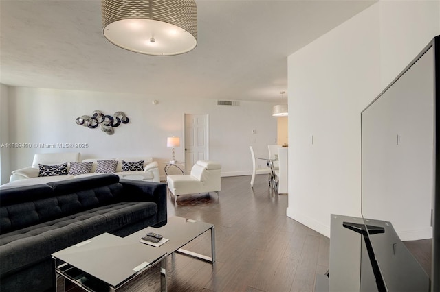 3801 S Ocean Dr Unit 5L, Hollywood, FL 33019 - living area featuring baseboards and dark wood-style flooring