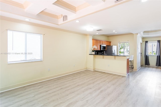 11647 NE 18th Dr Unit 11647, North Miami, FL 33181 - kitchen with appliances with stainless steel finishes, a peninsula, recessed lighting, a kitchen bar, and brown cabinets