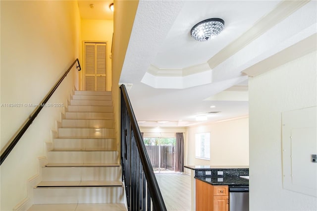 11647 NE 18th Dr Unit 11647, North Miami, FL 33181 - staircase featuring electric panel, a raised ceiling, and ornamental molding