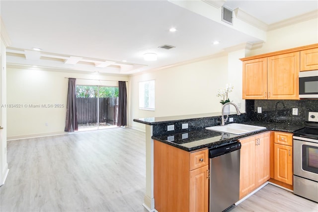 11647 NE 18th Dr Unit 11647, North Miami, FL 33181 - kitchen featuring appliances with stainless steel finishes, crown molding, light wood-style flooring, open floor plan, and dark stone countertops